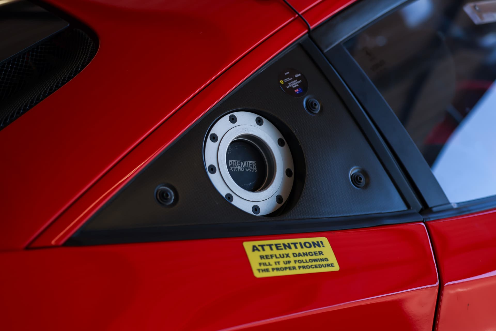 Fuel filler detail on a red Ferrari race car