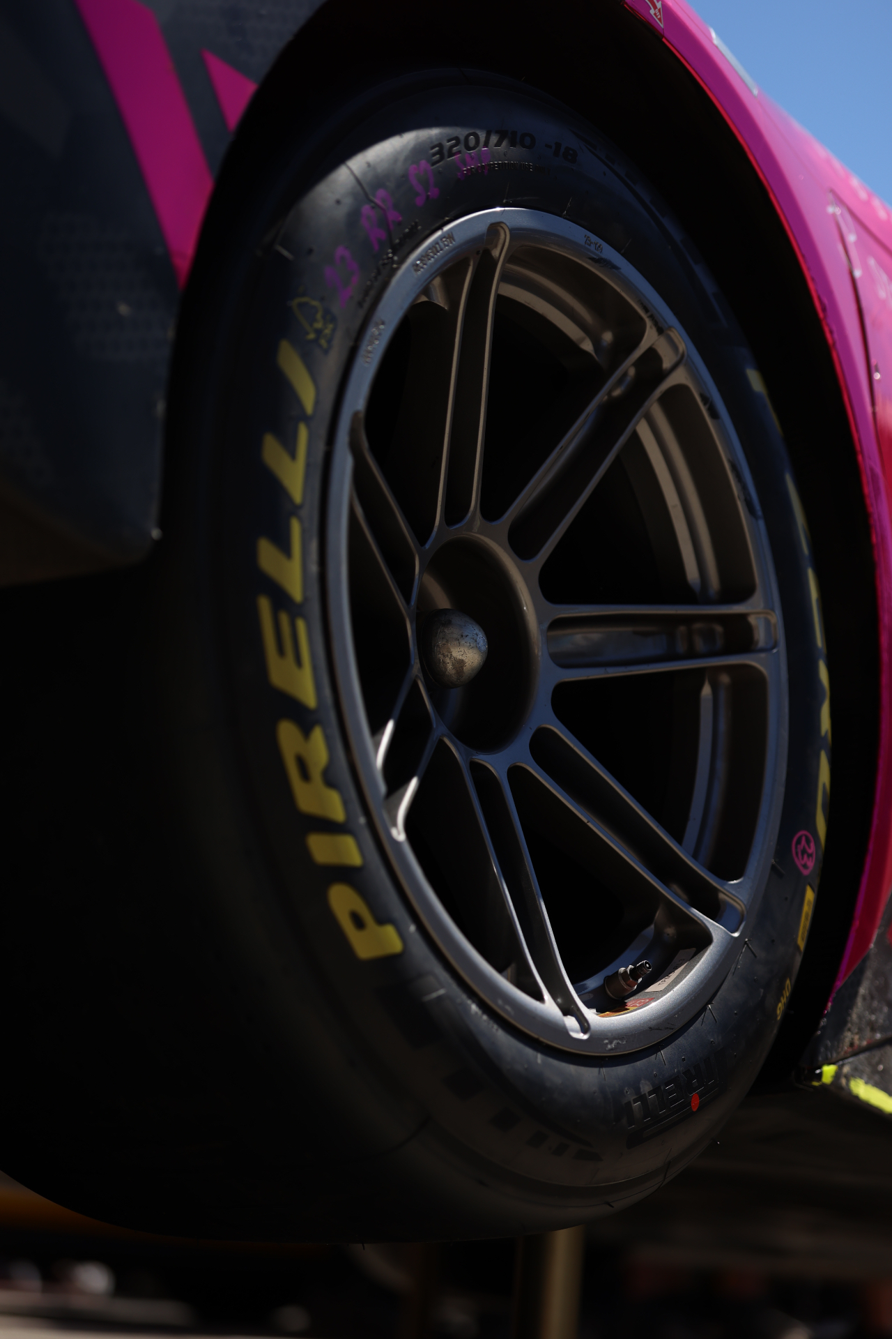 Pirelli racing slick mounted on a pink GT car