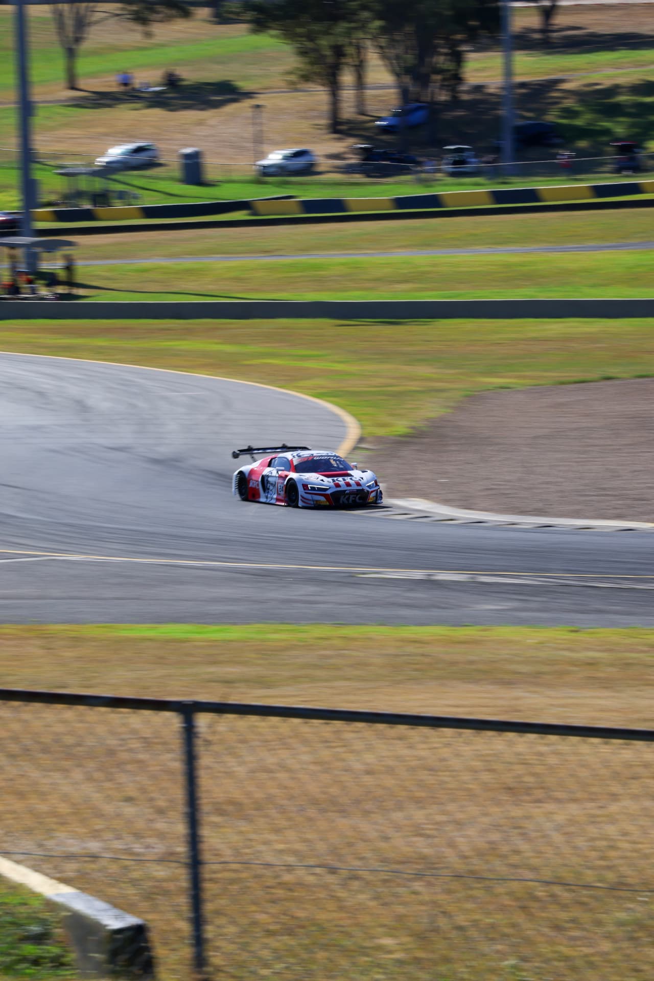 Blue and white Audi GT car on the circuit from the grandstand